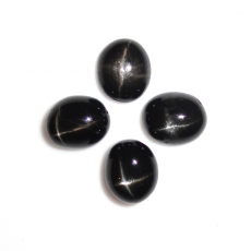 Black Star Diopside Cab Oval 12x10mm Approximately 23 Carat