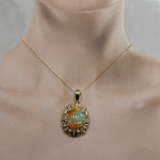 Ethiopian Opal Cab Oval 9.02 Carat Pendant In 14K Yellow Gold Accented With Diamonds