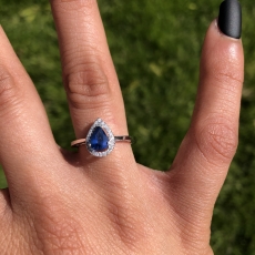 0.64 CARAT BLUE SAPPHIRE WITH DIAMOND HALO RING IN 14K WHITE GOLD