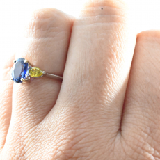 Blue Sapphire Oval 1.60 Carat Ring In Dual Tone(White/Yellow) Gold Accented With Yellow Fancy Vivid Diamonds