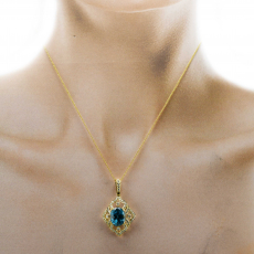 Blue Zircon Oval 6.24 Carat Pendant With Diamond Accents in 14K Yellow Gold  ( Chain Not Included )