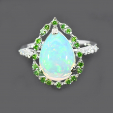 Ethiopian Opal Cab Pear Shape 2.67 Carat Ring In 14K White Gold Accented With White And Green Diamonds