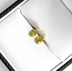 Yellow Diamond Oval 0.72 Carat Earrings with Accent White Diamonds in 14K Yellow Gold