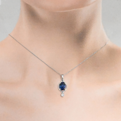 Nigerian Blue Sapphire Oval 1.63 Carat Pendant In 14K White Gold With Accented Diamonds (Chain Not Included).
